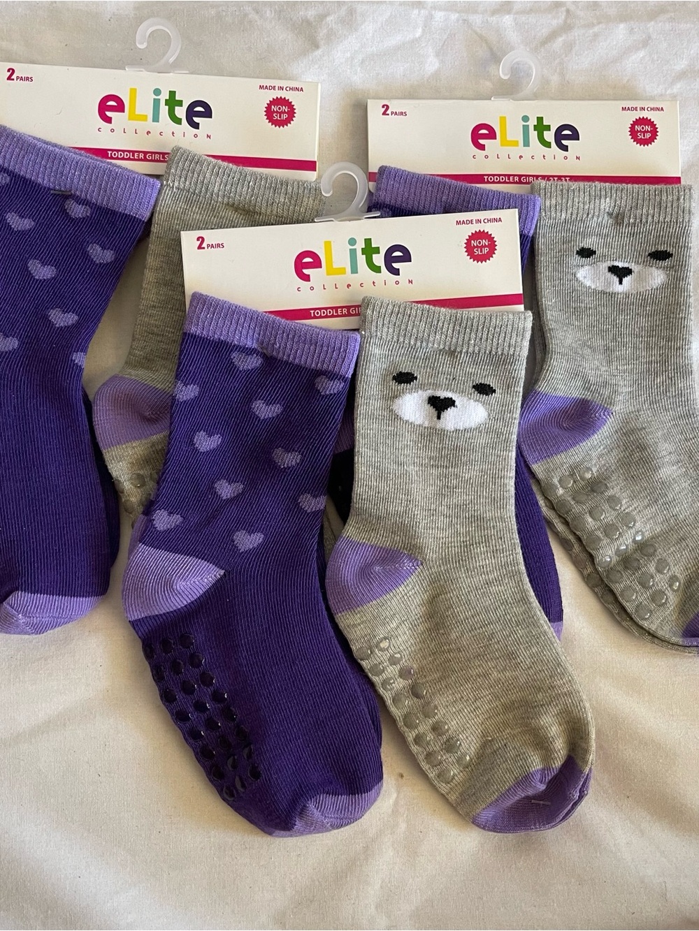 6 pair Non-skid Elite brand socks. Size 2T-3T Girls Socks purple